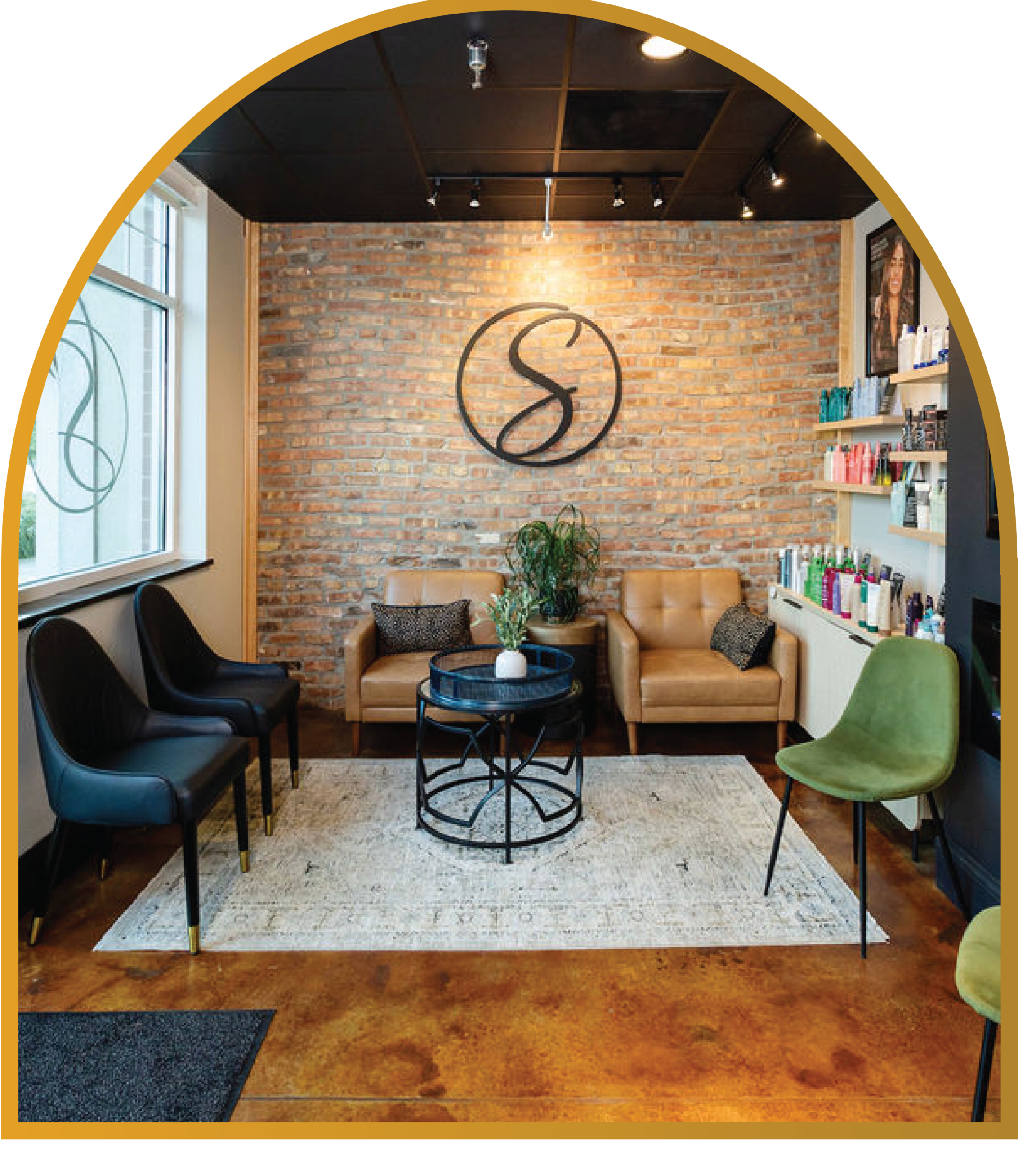 Thestrand-Homepgage-arch_Waiting-Room Interior view of the waiting room at The Strand Salon and Spa in Columbia, Missouri. Comfortable chairs and fine finishes give a welcoming and professional feeling to the waiting area.