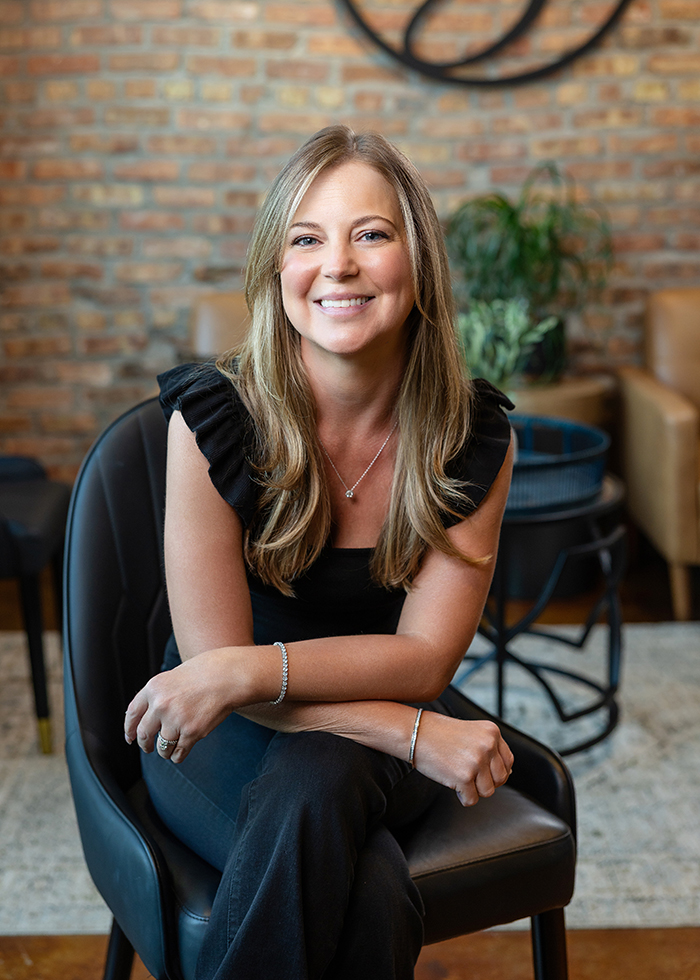 Catie-Hillyer_stylist_TheStrandSalonandSpa Catie Hillyer sits posed for a portrait in the waiting room at The Strand Salon and Spa located on the south side of Columbia, Missouri.