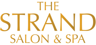 Text-only logo for The Strand Salon and Spa in a gold gradient effect