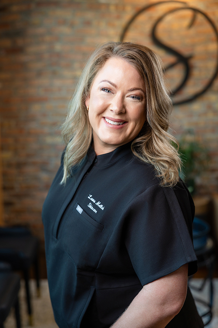 Laura-Melloh-Licensed-Esthetician-TheStrandSalonandSpa Laura Melloh poses for a portrait inside The Strand Salon and Spa where she offers skincare, waxing, and other esthetic services.