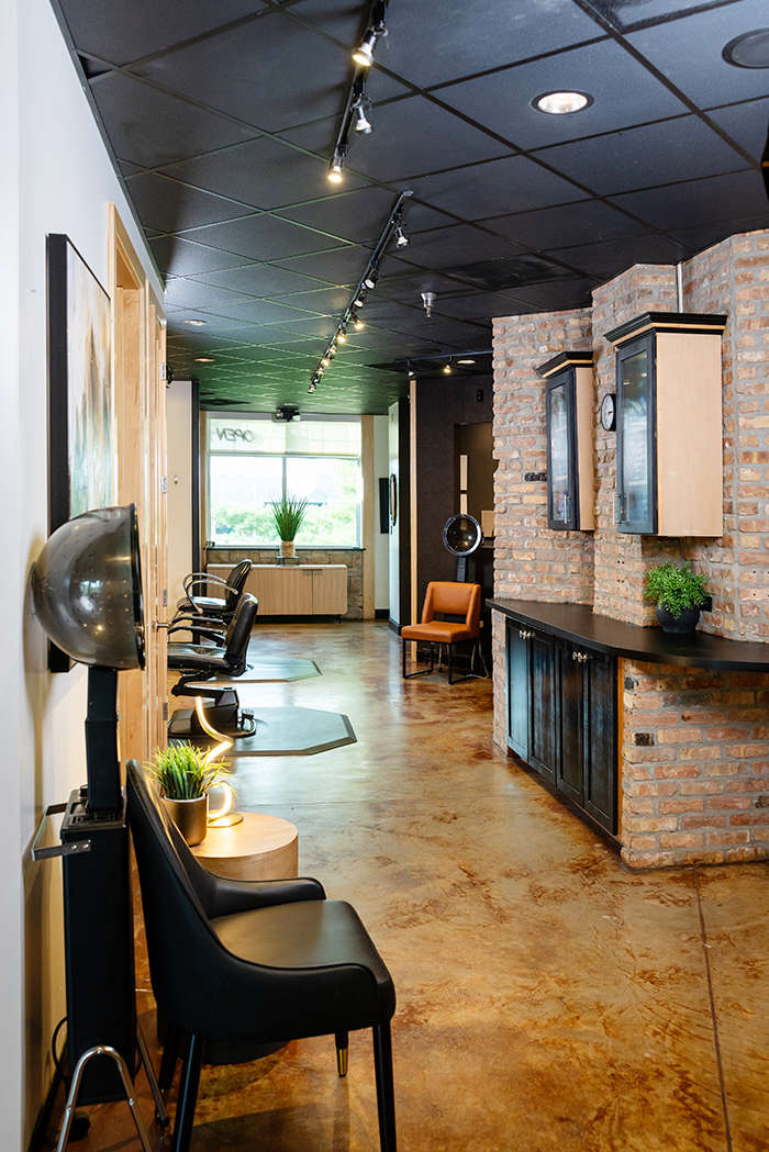 TheStrand-Salon-Columbia-Missouri-stations The Strand Salon and Spa in Columbia, Missouri has a friendly space with stained concrete floors, dark walls, and stone throughout. Luxurious finishes make the space feel like an elevated experience.